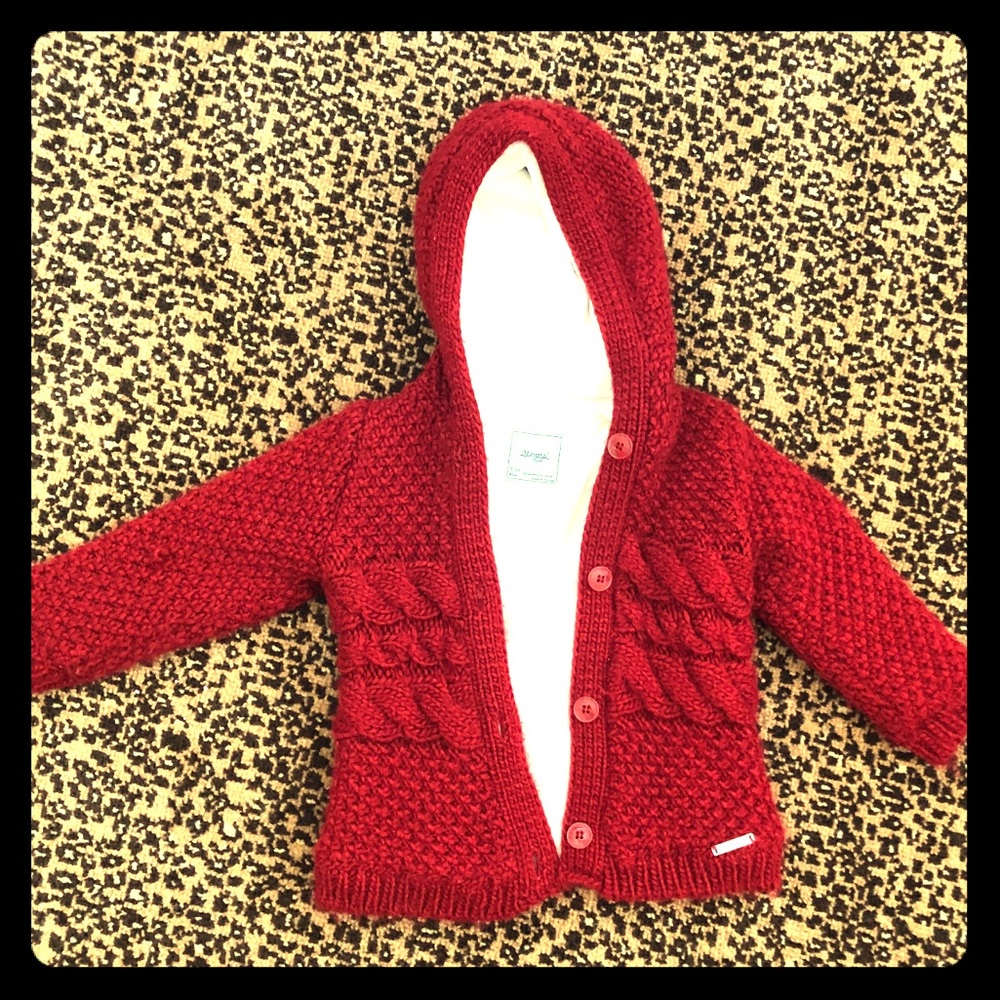 Cable knit red sweater.